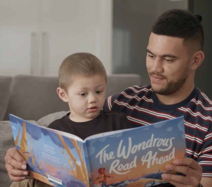 Redkite book club service Father reading a book to his kid from the Redkite Book Club service which provides free resources for cancer patients